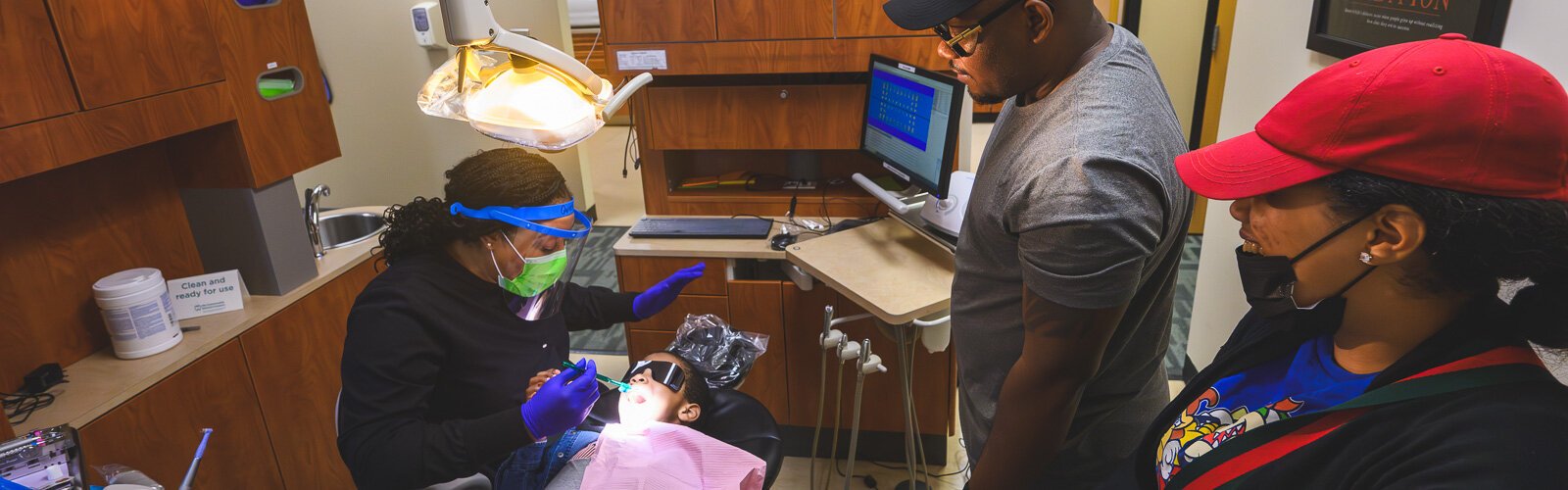 D'Andre Gipson and Rainah Caldwell with their son Giovanni at My Community Dental Centers of Detroit