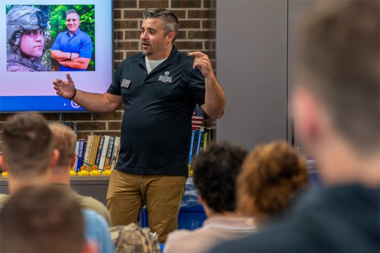  Shane Scherer, director of the Peter Secchia Military and Veteran Resource Center, speaks as part of the Military Connected/Student Veteran Orientation, which returned this fall as a way to provide specialized support for veteran students. 