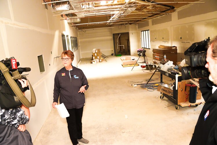 Executive director of CSNIP, Sharon Caldwell-Newton, leads a tour of the new 12,000-square-foot vet clinic.