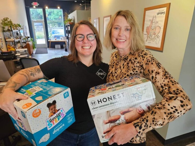 Annie Bishop, of Rise Wellness Chiropractic, is pictured with Kristin Revere, owner of Gold Coast Doulas. 