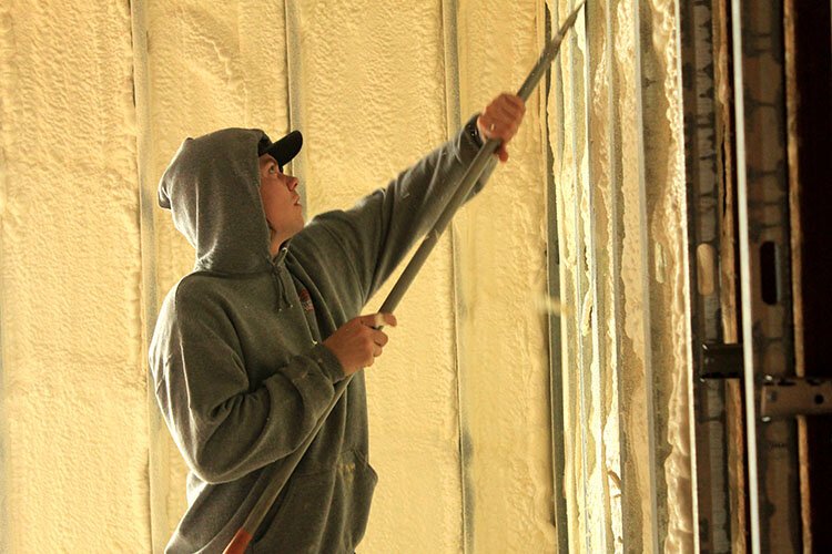 A worker adds installation in a new Jubilee Ministries mixed-income housing project being built in Holland. 