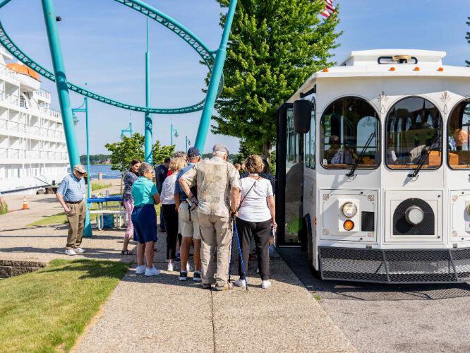 Passengers board a trolley at Muskegon's port for excursions.