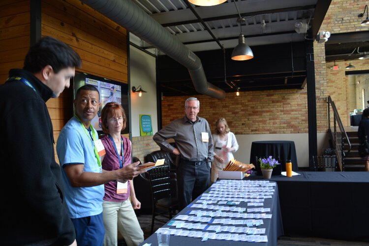 A group of passionate volunteers works in tandem to prepare for guests' arrival at MOWWM's More Than a Meal Luncheon. 