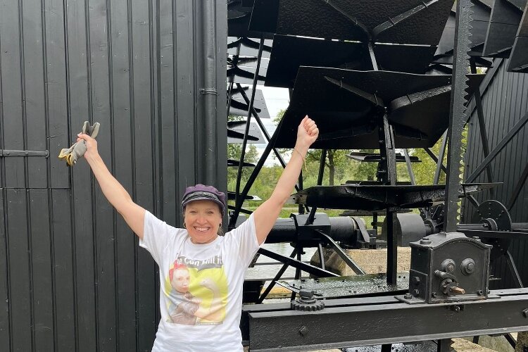 Alisa Crawford in front of the mill in the Netherlands where she took her exam. 