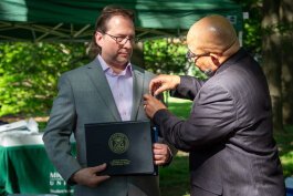 Michigan Department of Military and Veterans Affairs Director Brian Love awards Chris Petras with th