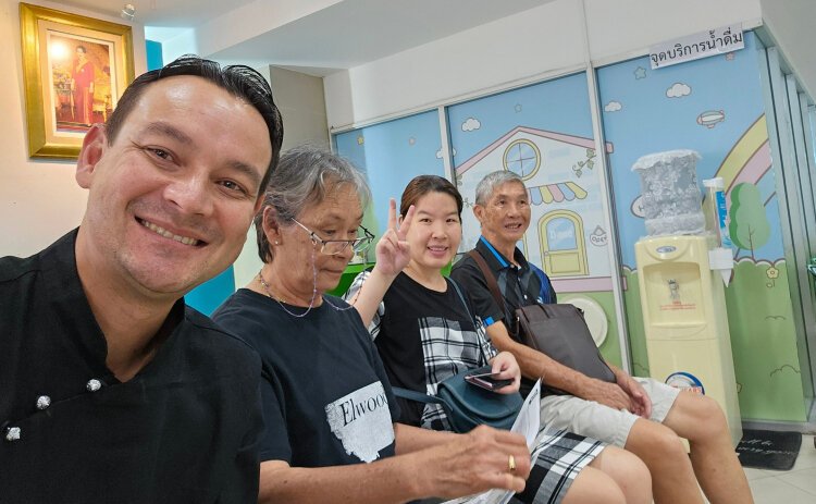 Charles Elwood (left) with his aunts, uncles, and mother at the Lad Prao government Office in Bangkok getting his Thai citizenship.