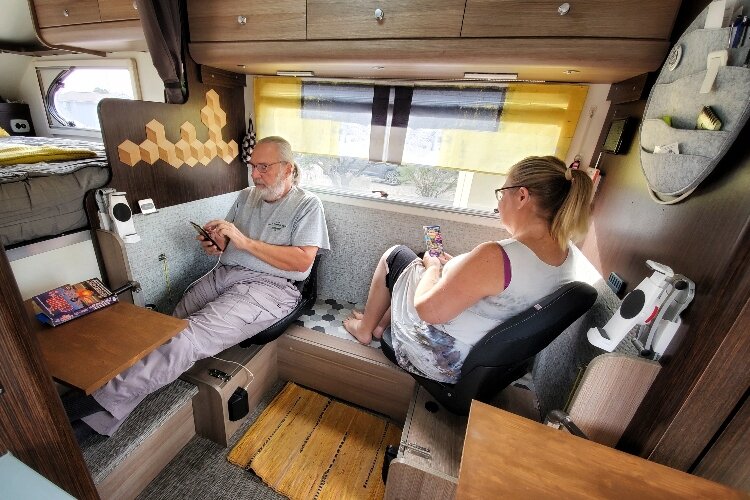 Kelli Nina Perkins and Bill Parrott inside their camper