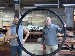 CW Marsh owner Dan Wehrwein (right)  stands with a company employee to showcase a prototype seal designed for the Hoover Dam project.