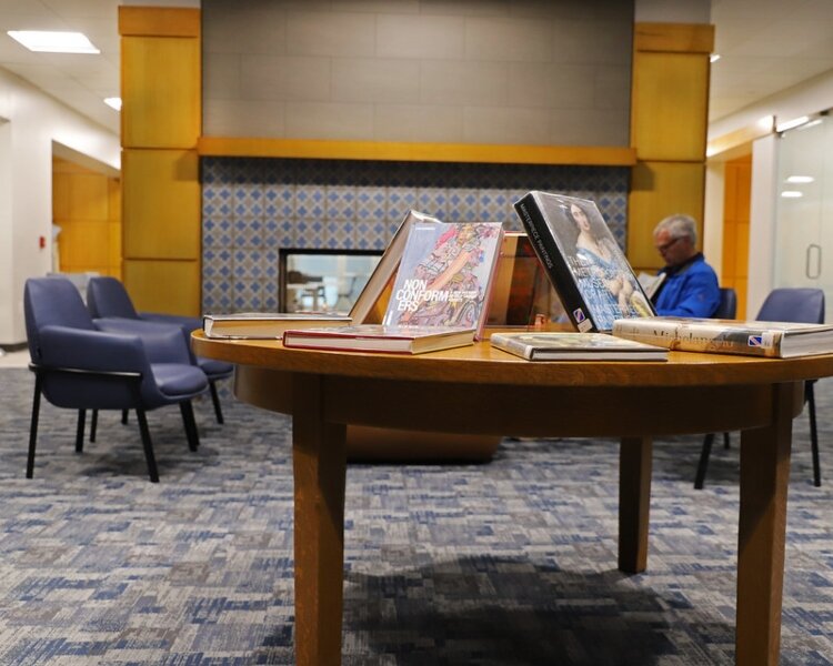 A cozy reading area sits next to Herrick District Library's new fireplace.