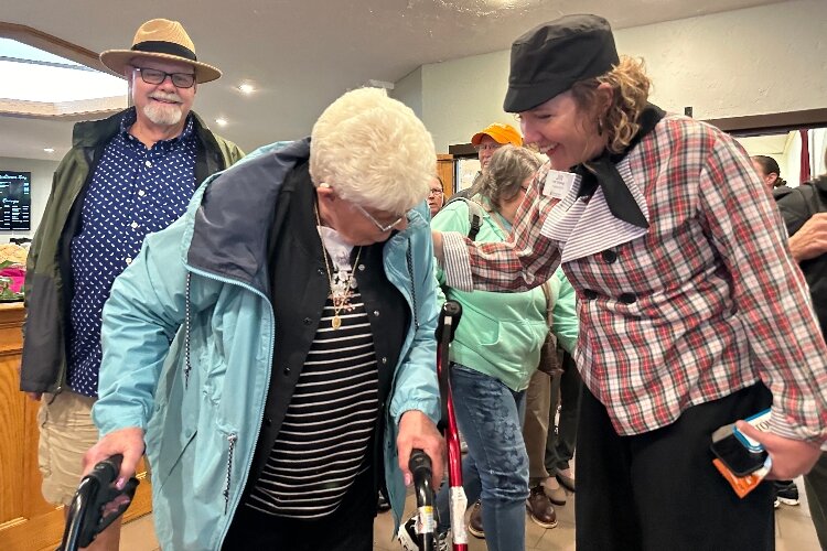 Evergreen Commons CEO Jill Ver Steeg talks to Tulip Time visitor.  