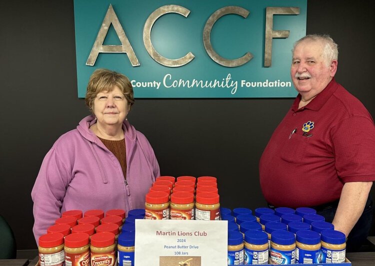 The Martin Lions was one of many organizations that helped to stock Allegan County pantries with peanut butter last year.