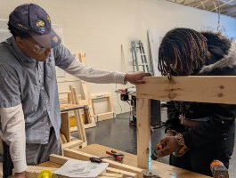 Sophomore MPS students Kaeden Smith (left) and Ja'Ziiyah Wyrick apply math concepts to build flower boxes in their Geometry in Construction class.