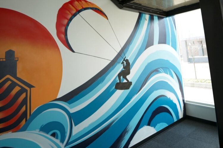 Lakeshore Advantage commissioned muralist Chris Garcia to decorate the interior of their new building, the Next Center.