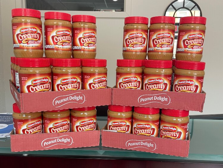 Stacks of peanut butter await pickup after last year's Allegan County Community Foundation peanut butter drive.