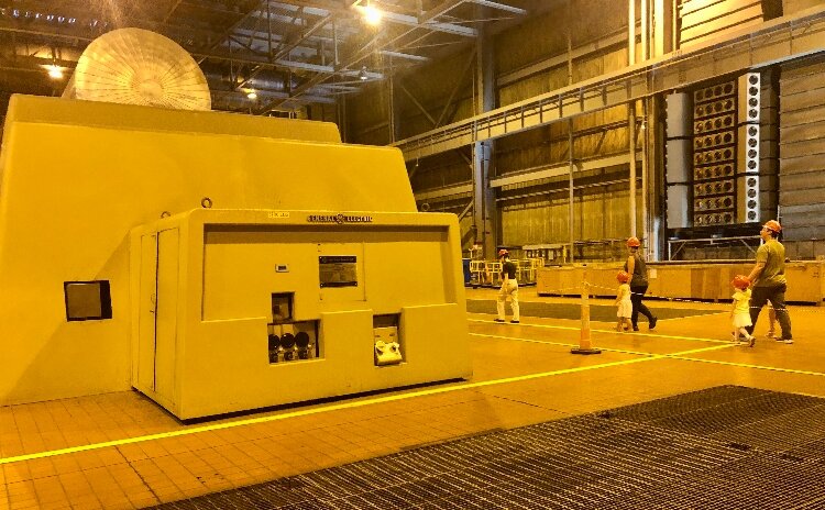 Stephanie Aubin of Holland finds the vast machinery on the J.H. Campbell Unit 3 turbine deck amazing, kindling her fascination with abandoned old technologies.