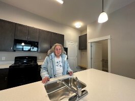 Sandra March has a new home that will bring financial independence and the ability to enjoy a few simple luxuries.