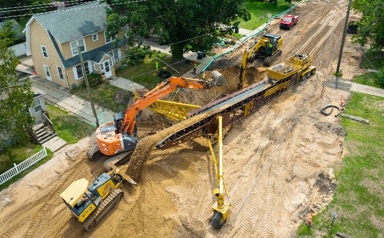 The aerial photo shows the Muskegon Department of Public Works at work on the Sanford Street Lead Service Line Replacement project.