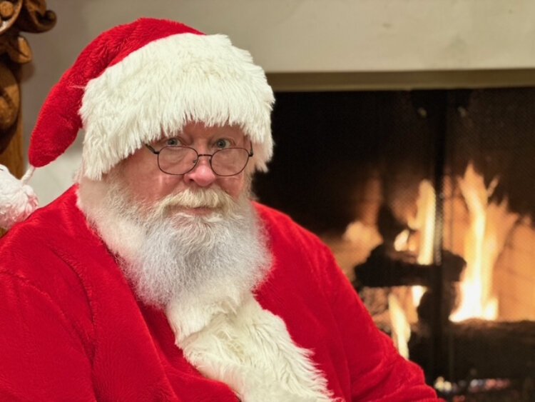 For Les Tucker, playing Santa is about making people feel seen, heard, and loved in some small way, even for just a few minutes. 