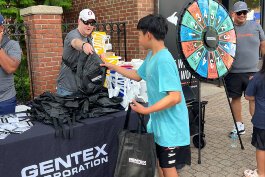 Gentex is celebrating 50 years of business and 20 years of downtown Holland's street performer series with games, prizes, and more.