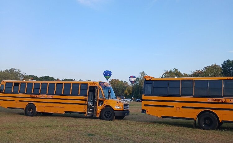 From where the Hudsonville Public School buses were parked, spelling out their special message, the hot air balloons could be seen taking off.