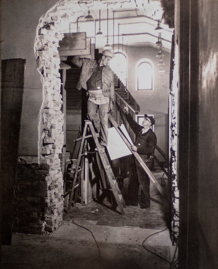 This vintage photo shows Vander Meulen Builders employees at work.  