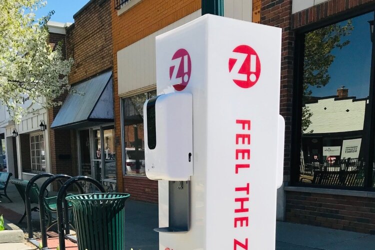 Two outdoor hand sanitizing stations have been placed in high-traffic areas along Main Street