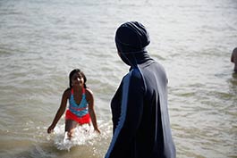 list-E.H.-taking-her-daughter-for-a-swim-at-Cass-Lake.jpg