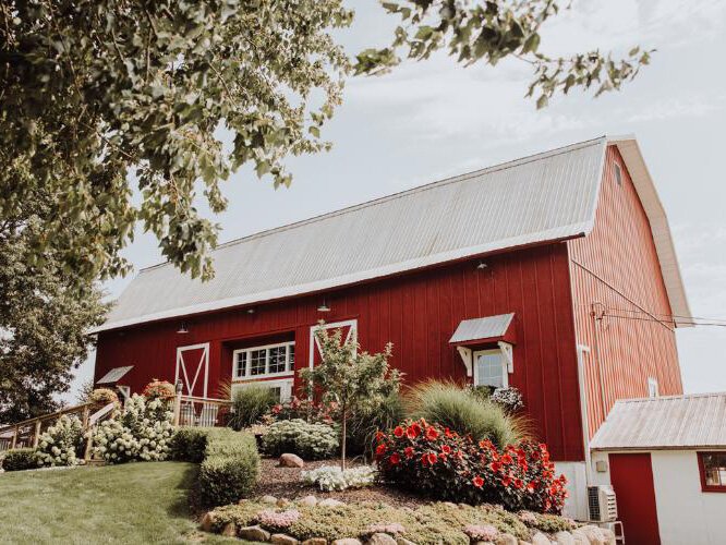 The iconic red barn at Barn 1888, a wedding venue in Hopkins.