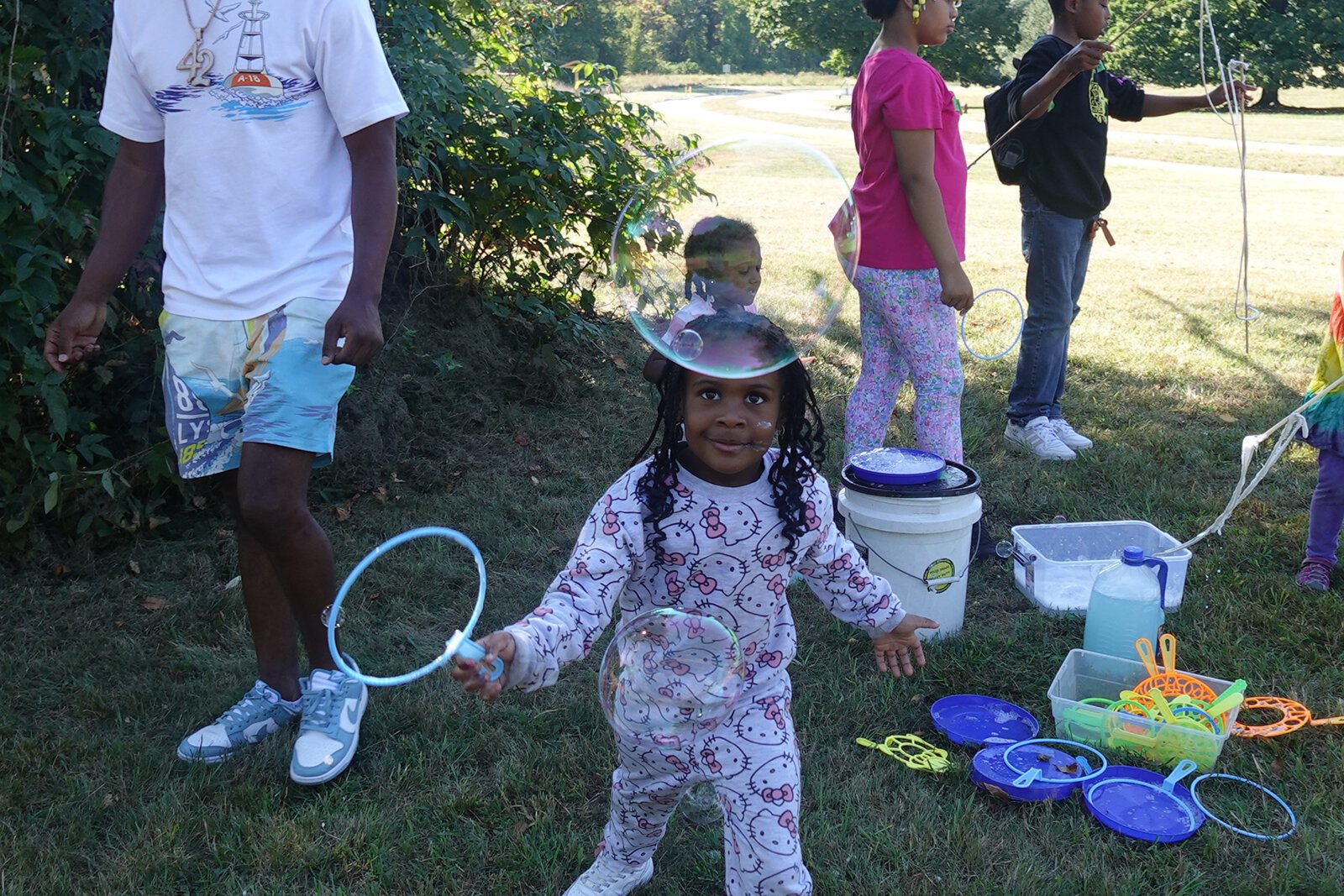 Children play during a campout at Eliza Howell Park.