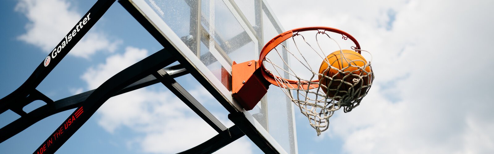 People play basketball during a Pistons Neighbors program session in Rouge Park.