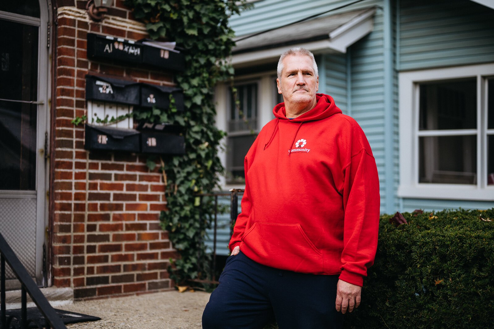 Ronnie Stienke stands outside his apartment in Pontiac. He credits finding housing with helping him to get sober after 32 years of addiction.