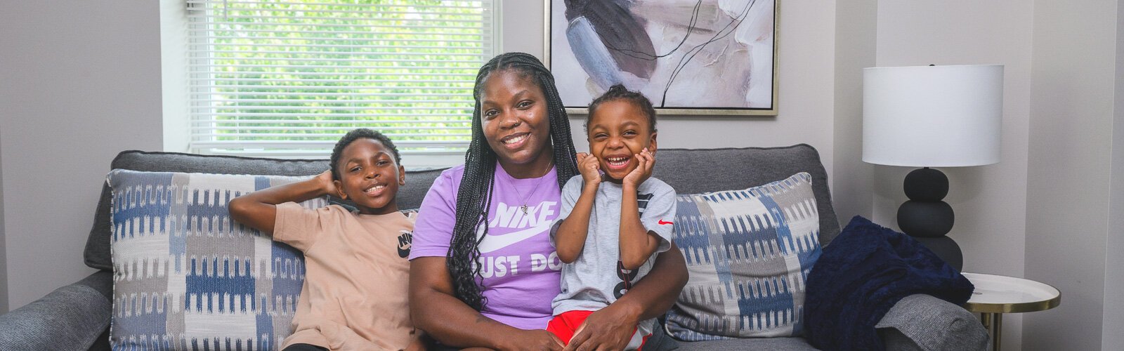 Dallas, Jamillyah, and Dayton Palmer in their new home in Pontiac.