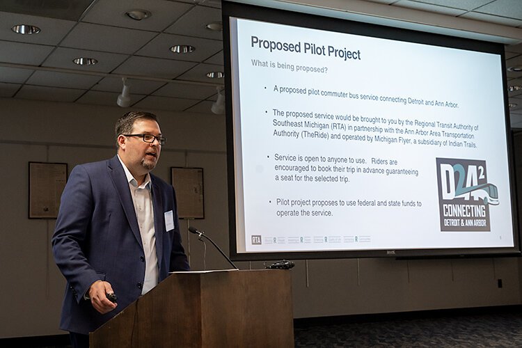 RTA COO Matt Webb leading the Detroit-Ann Arbor pilot express bus service meeting at the downtown Ann Arbor District Library Branch.