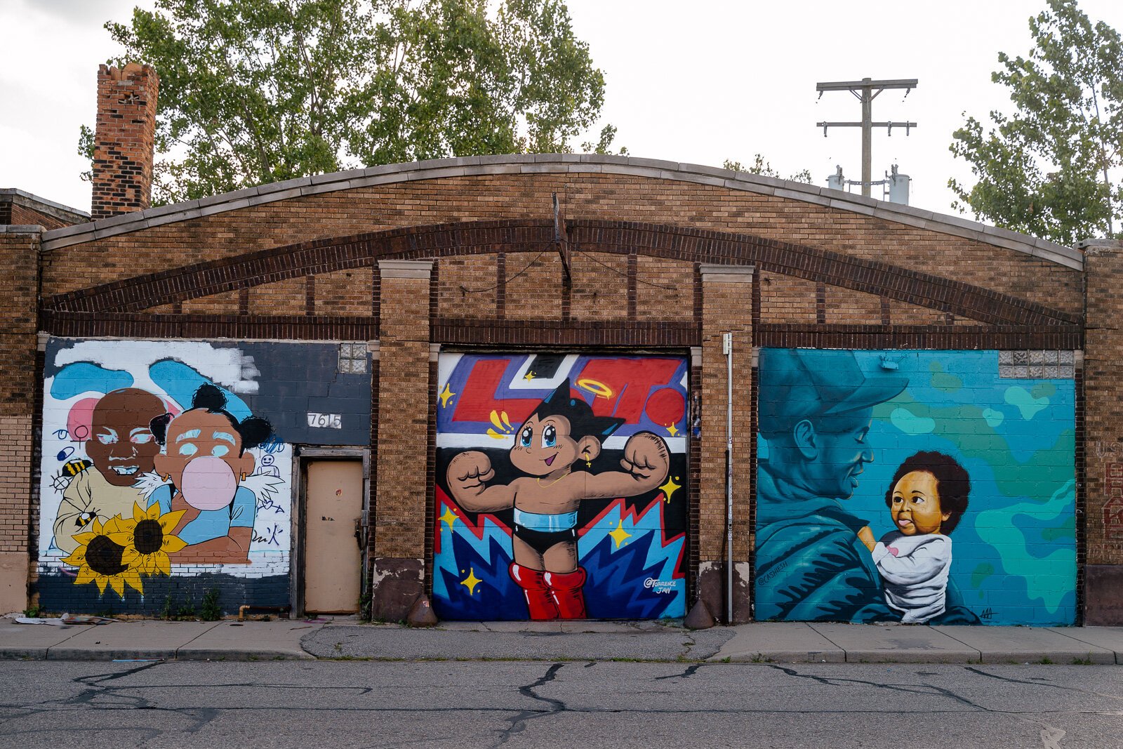 From middle to right, Torrence Jayy and JC3 murals on Oakland Ave. at the One Mile art space