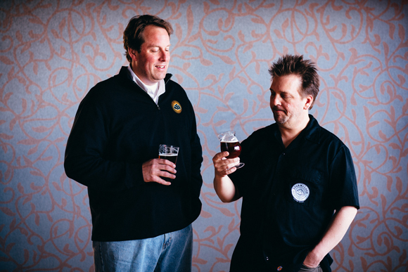 RICK SCHMITT (LEFT) STANDS WITH BREWMASTER BRIAN CONFER.