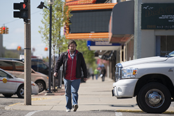 A pedestrain walking through Downtown Bay City - Avram Golden