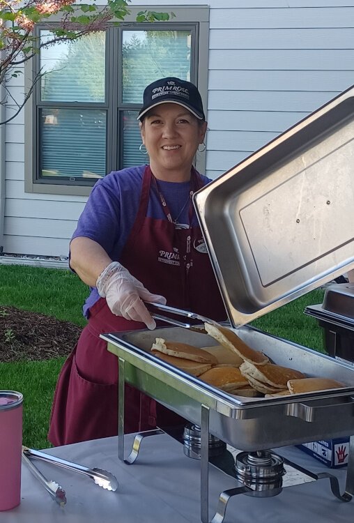 Primrose volunteer serves up pancakes