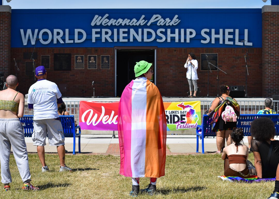 People gather in front of the Wenonah Park World Friendship Shell at the 2022 Great Lakes Bay Pride Festival, Bay City