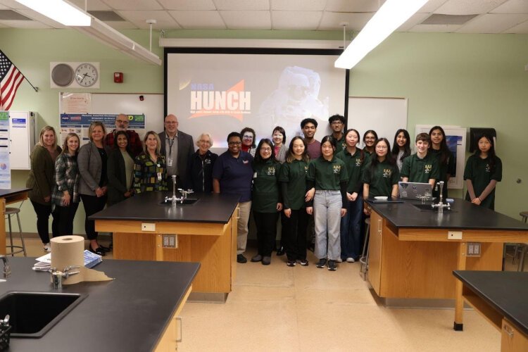 Associate Superintendent Dr. Ken Weaver, along with the Curriculum Department from Midland Public Schools, pose with the Dow High Space Farmers and guests Nancy Hall and Dr. Florence Gold from the NASA HUNCH program.