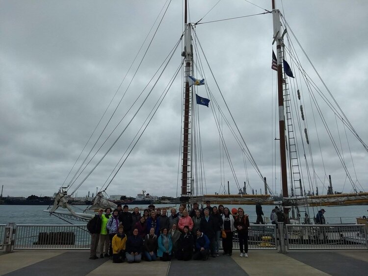 A group of outdoor educators by Appledore IV in Bay City. 