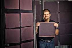 Rob Burdine of Paperworks Studio hanging paper to dry