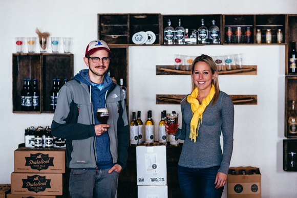 Head brewer Mike Wooster (Jolly Pumpkin) stands with marketing associate Megan Glunz (Northern United Brewing).