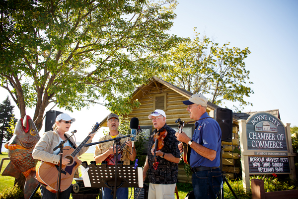 The Wooden Nickels play in front of the Boyne City Chamber of Commerce.