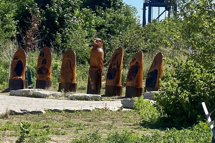 Native American artwork titled "Seven Grandfather Teachings" was created by Garrett Nahdee on the Blue Water River Walk.