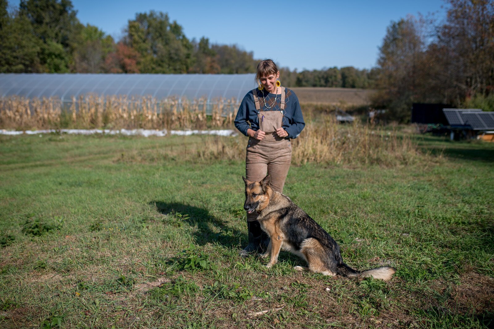 Larissa Touloupas, co-owner of Solfed Farms, with dog Dasha.