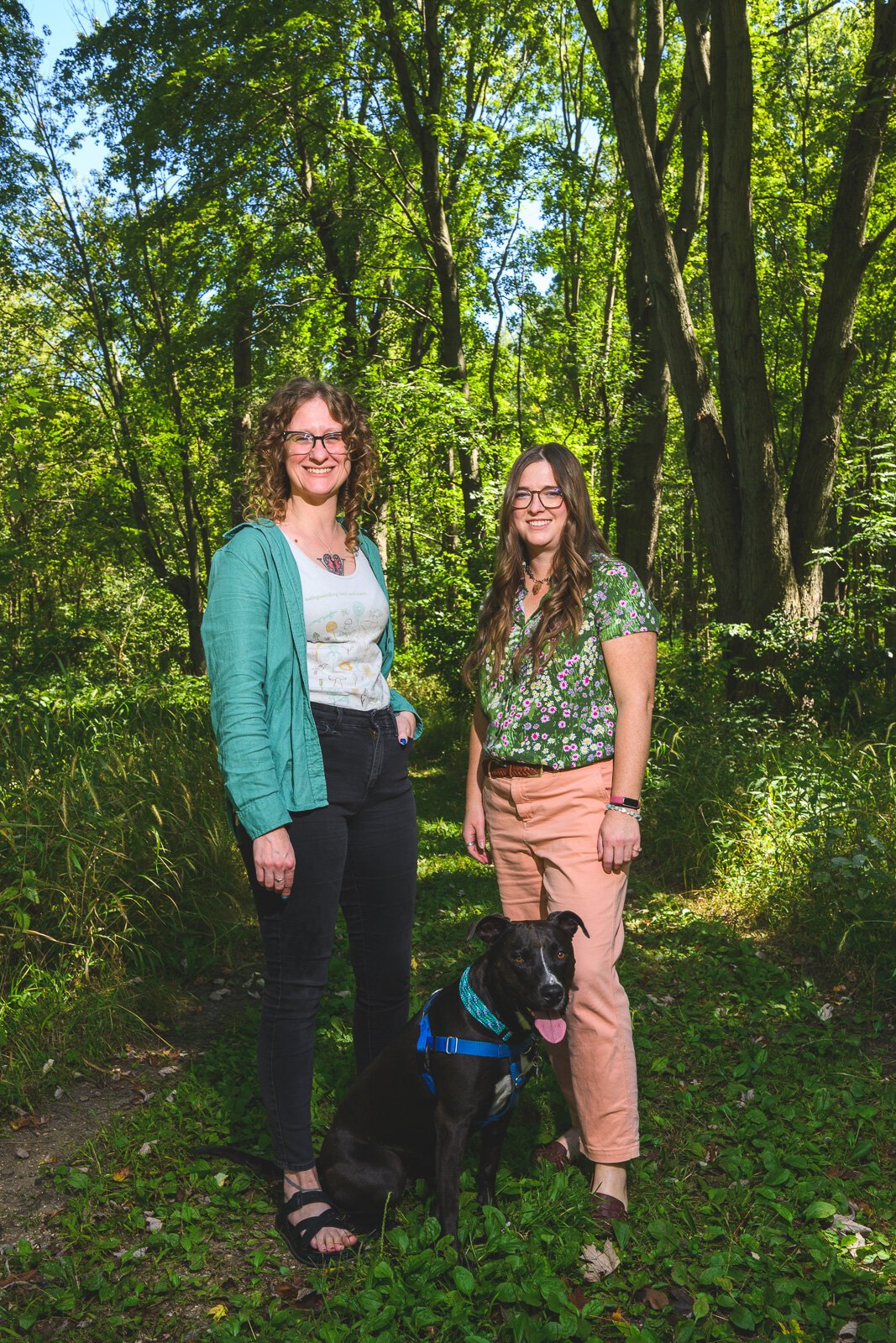 Krista Gjestland, Susan LaCroix, and Zinnia the dog at Iron Creek Preserve.