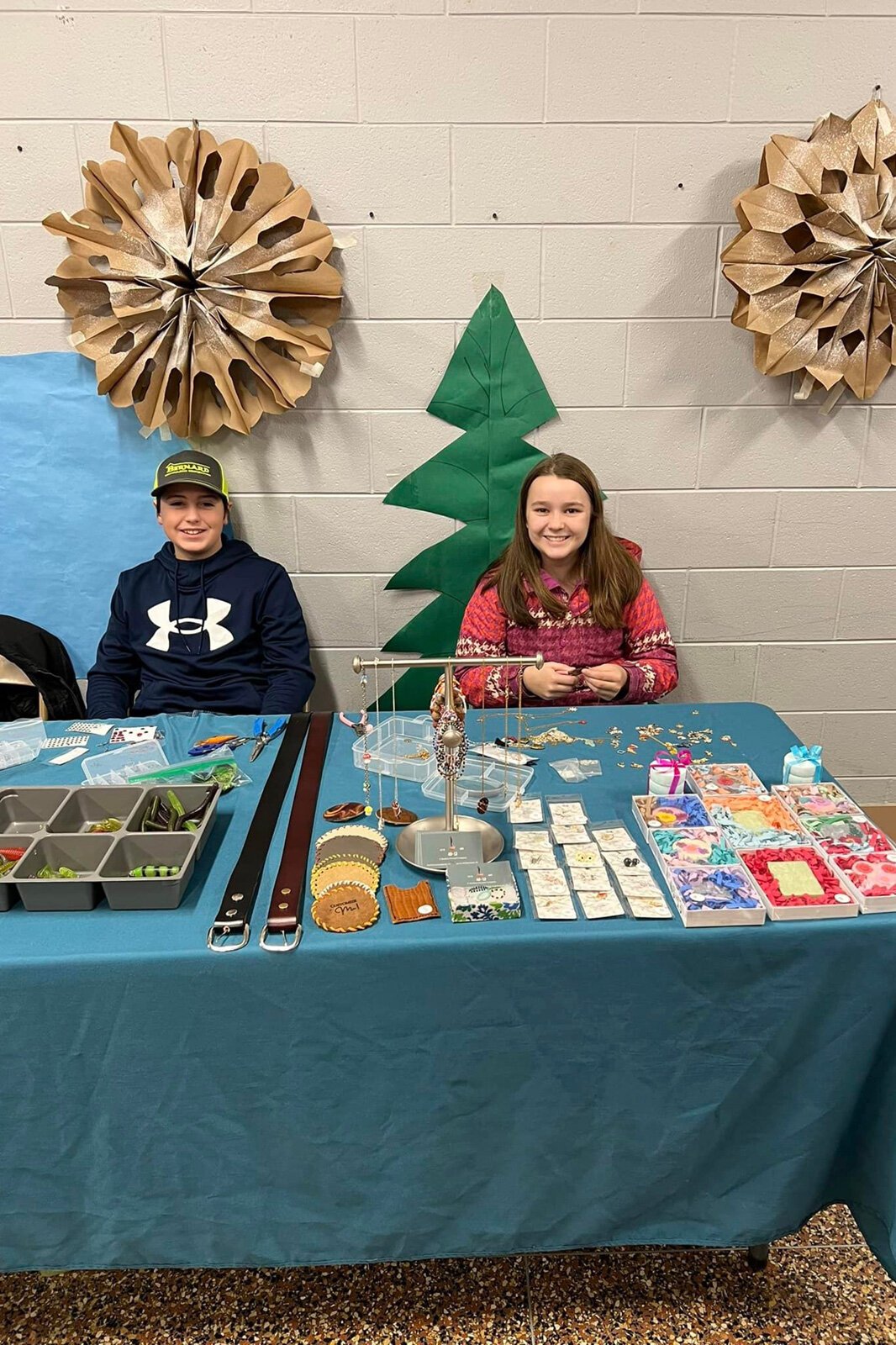 Manchester Entrepreneurial STEM students selling merchandise.