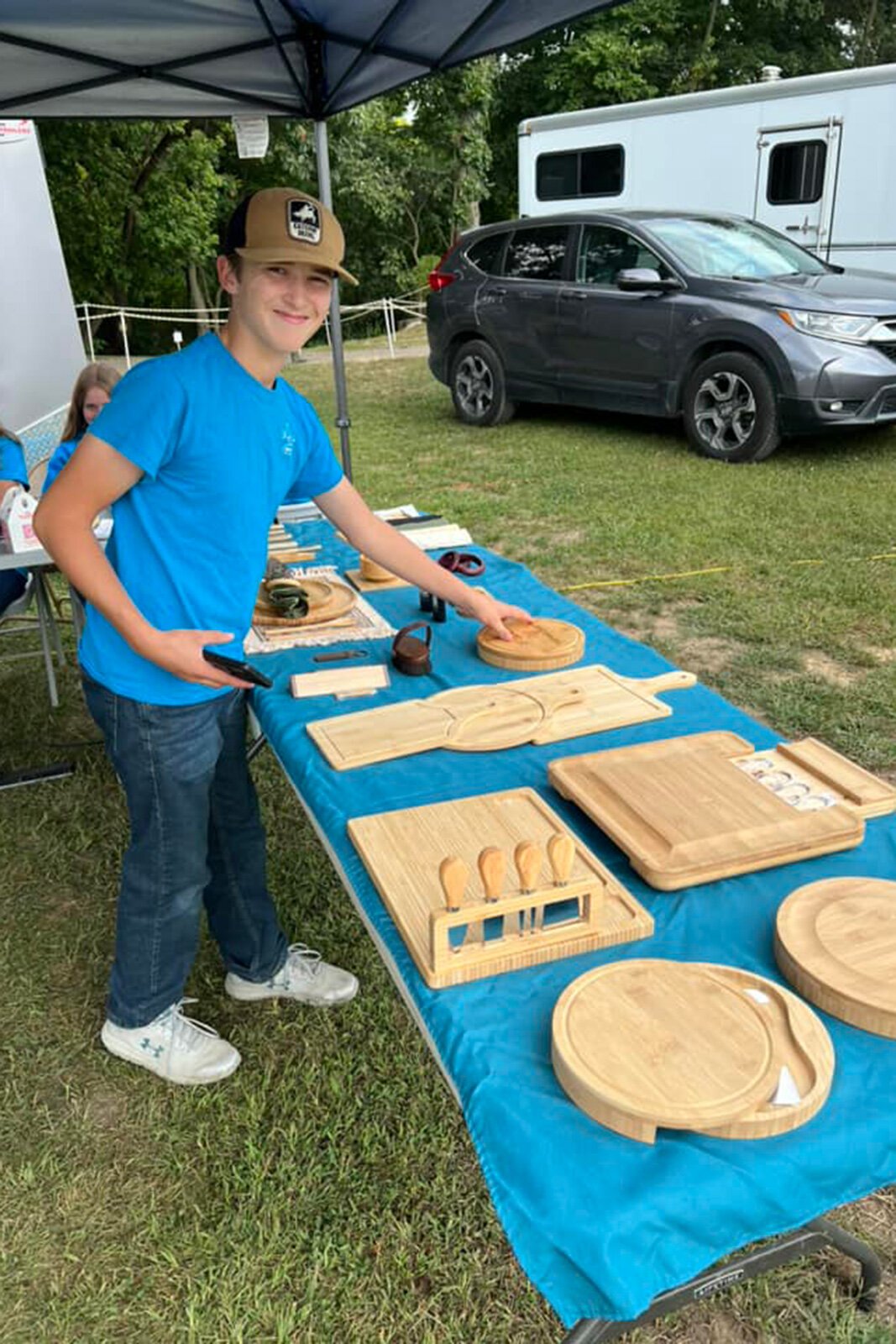 Manchester Entrepreneurial STEM students selling merchandise.