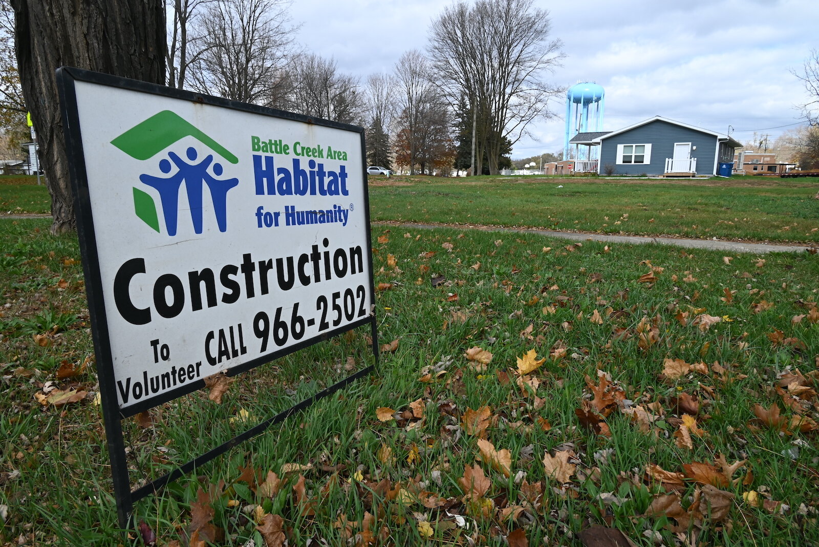 A sign on West Michigan Avenue indicates a Habitat for Humanity construction site near LaMora Park Elementary.