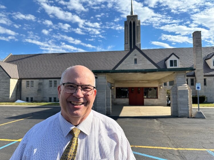 Rev. Dan Anderson standing in front of Spring Lake Presbyterian Church.